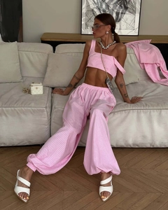 Detail of pink striped crop top and drawstring joggers with light cotton texture