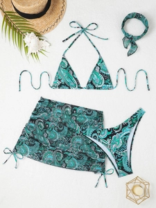 Flat lay of a 4-piece paisley print bikini set with sarong and matching hairband
