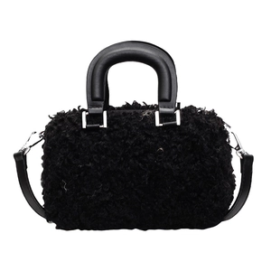 Fuzzy black faux fur handbag with leather handles and detachable shoulder strap