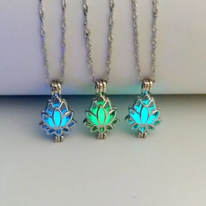 Detailed view of lotus flower glowing necklaces in blue, green, and cyan luminous colors