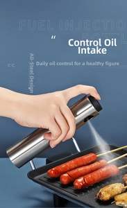 Action shot of stainless steel oil sprayer misting food for healthy grease control