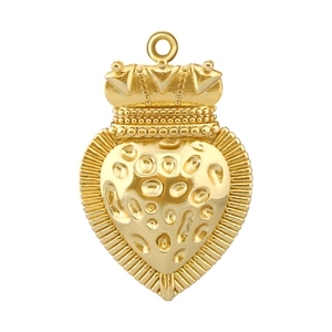 Close-up of a vintage heart pendant with crown design and textured gold finish
