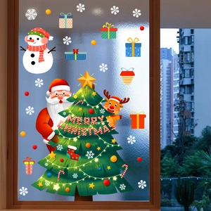 Detail of Santa and Reindeer static window stickers on a frosted glass surface