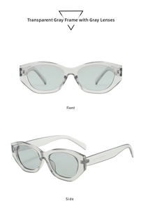Macro view of transparent grey cat-eye sunglasses with thick frames and grey lenses
