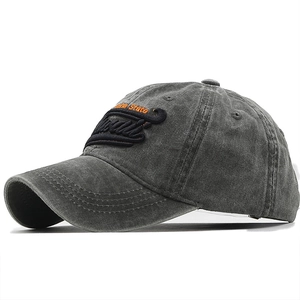 Close-up of gray washed cotton baseball cap with orange Hawaii embroidery and black lettering