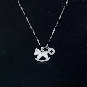 Silver horse necklace with zircon and shell coin pendant for women on black background