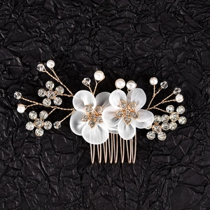 Exquisite bridal hair comb with white mesh flowers and sparkling rhinestone accents