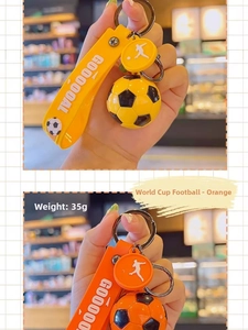 Detail of football keychains with GOOOOOAL silicone strap and soccer player silhouette