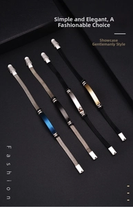 Detailed close-up of stainless steel bracelets in silver, black, gold and blue finishes
