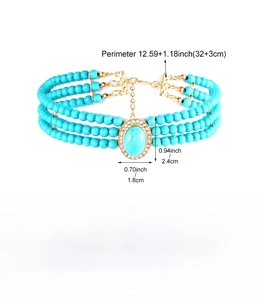 Close-up of three-layer beaded choker with turquoise stone and sparkling rhinestones