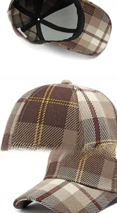 Detalle de gorra de béisbol de cuadros mostrando el forro interior y costuras de la visera