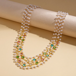 Vintage multi-layer sweater necklace with faux pearls and colorful gemstones on gold chain