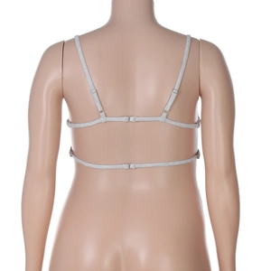 Detail of adjustable straps and racerback buckle on light gray cropped camisole top