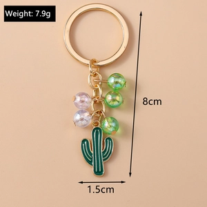 Detail view of green beaded cactus keychain with gold ring and size dimensions