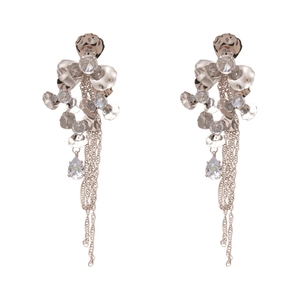 Silver flower tassel earrings with zircons and teardrop crystals on white background