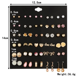 Detailed set of 36 pairs of crystal and pearl stud earrings with size measurements