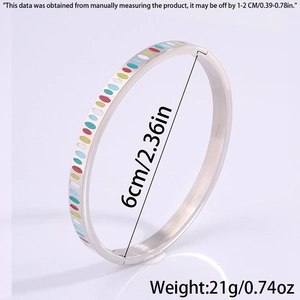 Detailed view of silver heart bangle with colorful enamel dots and sizing parameters
