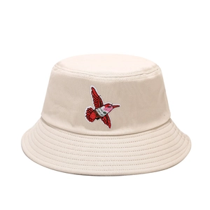 Cream bucket hat with red hummingbird embroidery for sun protection and casual outdoor style