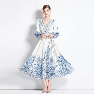 Elegant white V-neck long sleeve maxi dress with blue floral prints and waist tie belt