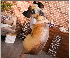 Realistic dog head long plush pillow held by a person in a cozy vintage home setting