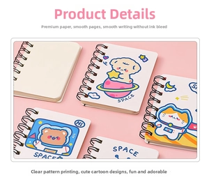 Detail of A7 mini spiral notebooks featuring cartoon astronaut and space cat illustrations