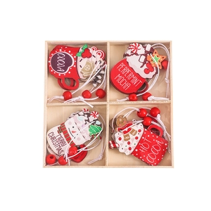 Wooden Christmas tree ornaments set with gingerbread man and cocoa cup designs in a box