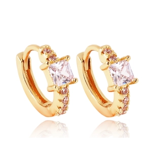 Detailed macro view of gold plated hoop earrings with square pink crystal stones