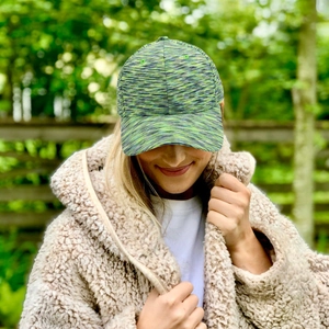 Outdoor camouflage baseball cap with green mixed knit texture and curved brim for sun protection