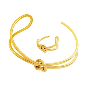 Golden double-layer knotted bracelet and ring set in minimalist stainless steel style