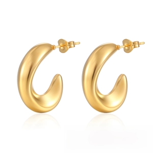 Macro view of 18K gold plated stainless steel chunky C-shape hoop earrings on white