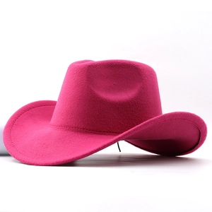 Macro view of bright fuchsia felt cowboy hat with wide brim and detailed wool texture