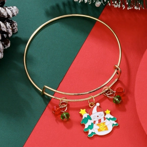 Detail of Christmas gold bracelet with enamel snowman, tree and red green beads