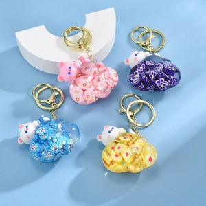 Cloud oil bear keychain set with colorful sequins and gold clips in four vibrant colors