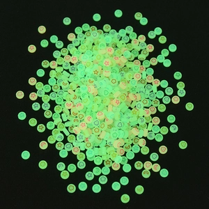 Glow-in-the-dark green beads with red star and moon patterns for DIY jewelry making