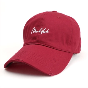 Close-up of New York embroidery and distressed detail on a vintage baseball cap