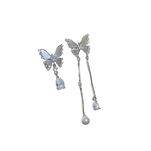 Asymmetric butterfly earrings with mother of pearl, cubic zirconia and white pearls