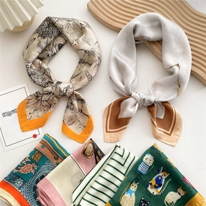 Collection of elegant silk square scarves with vintage floral and geometric patterns