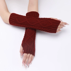 Close-up of dark red fingerless knit gloves with a diamond jacquard pattern texture