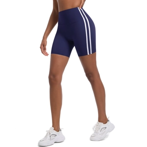 Detail of high-waisted navy yoga shorts with white side stripes and breathable fabric