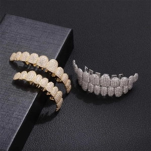 Iced out hip hop grillz set in 14K gold and silver plating with shiny zircon diamonds