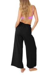 Vue arrière du pantalon large en coton noir à taille haute et ceinture élastique