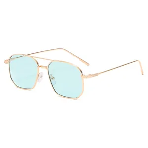 Retro double-bridge sunglasses with gold metal frame and light blue lenses in a modern style
