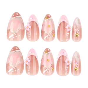 Short almond press-on nails with 3D pink flowers, pearls, and star accents on nude base