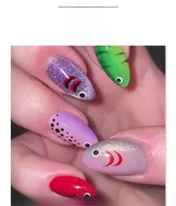 Detail of 3D cat-eye press-on nails with colorful fish patterns and glitter finish