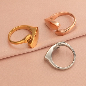 Detailed top view of adjustable wrap rings in gold, rose gold, and silver finishes