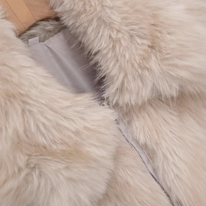 Women's beige faux fur jacket with collar and high-quality metal zipper detail