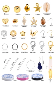 Flat lay of DIY jewelry kit with metal charms shells beads and elastic cord tools