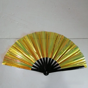 Detail of 33cm Kung Fu fan featuring holographic gold and green laser film on black bamboo ribs