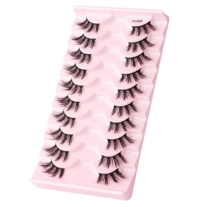 Detailed macro view of 10 pairs of dense natural half false eyelashes in a pink tray