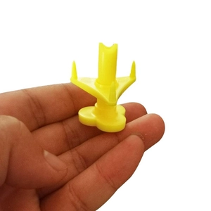 Portable yellow plastic coconut opener tool with ergonomic grip and sharp punch tip